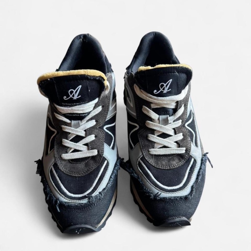 Axel Arigato Black and White Distressed Sneakers
